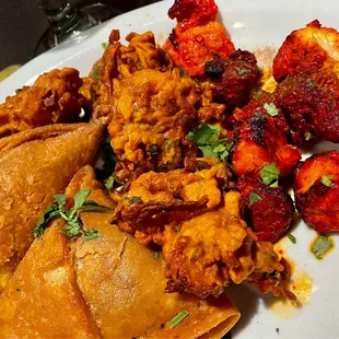 Samosa, Pakora, Tikka lamb and chicken
