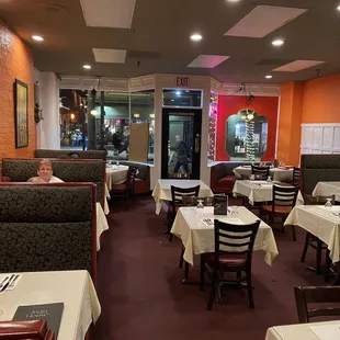 a restaurant with tables and booths