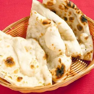 CLASSIC NAAN Classic leavened bread made with All- purpose flour and baked in the tandoor