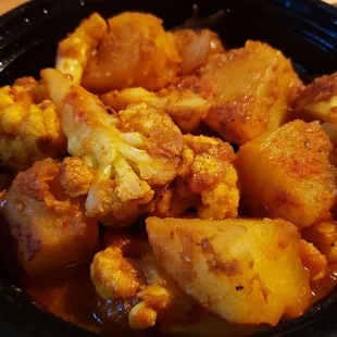 Alu gobi ($13), vegan by default. Not great. The potatoes were under-cooked and the dish didn't come together.