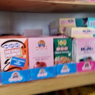 a shelf full of cereal boxes