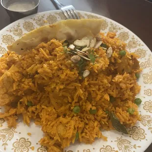 Biryani with chicken and saffron rice. My friend loved it and it is such a large portion he had leftovers to take home!