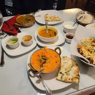 Butter chicken, lamb curry, chicken soup, garlic naan, &amp; raita.