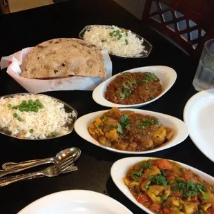 Feasting. Eggplant, cauliflower, mixed veggies, and roti. So. Good.