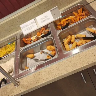 a buffet with a variety of food items