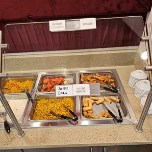 3 the right side of the back table.  Zoom in to see the dish names lower glass and the top of the glass.