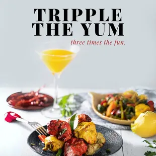 "Three Times the Flavor in Every Skewer"--Trio Chicken Kebab at India Palace Restaurant. This exquisite dish features three varieties