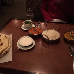 Naan, saag paneer, raita, chicken tikka masala, rice, rogan josh