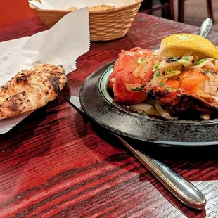 Garlic Naan on the left, Chicken tika Tika on the right.