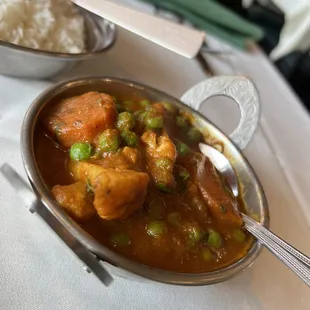 a bowl of curry and a bowl of rice
