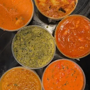 a variety of soups in bowls