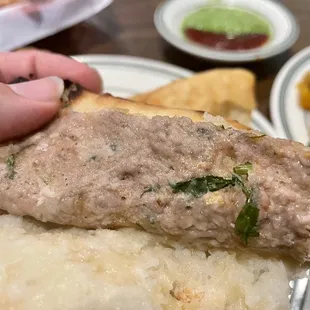 Keema naan: traditional naan stuffed with spiced minced lamb. Not on the buffet. Order it!