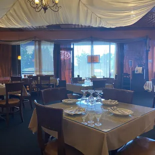 a dining room with tables and chairs