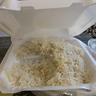 The leftovers after 2 adults ate! This amount came with 2 entrees. Rice is always perfectly done!