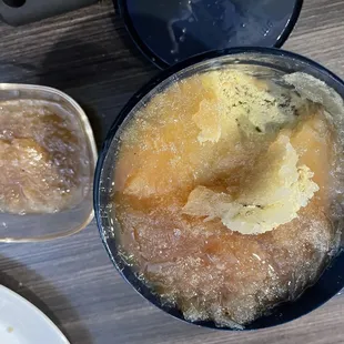 a bowl of sugared doughnuts and a bowl of sugared doughnuts