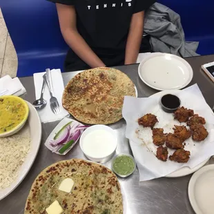 a person sitting at a table with food