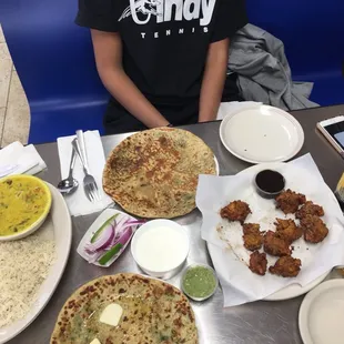 a person sitting at a table with food