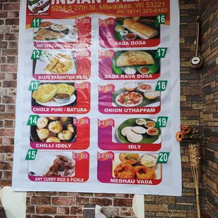 a menu on a brick wall