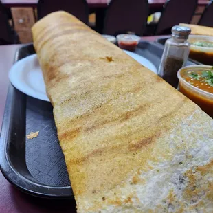 a large flat bread on a tray