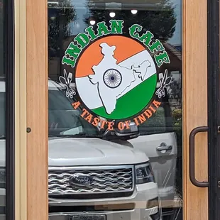 a white truck parked in front of the restaurant