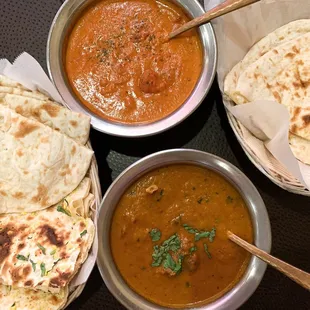 Chicken tikka masala (top) &amp; goat curry (bottom) with plain and garlic naan