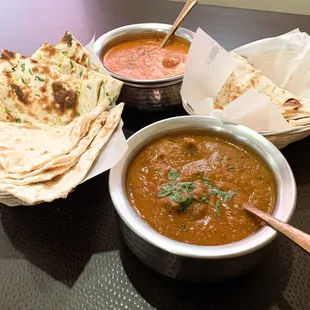 Chicken tikka masala (top) &amp; goat curry (bottom) with plain and garlic naan