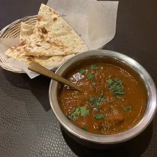 Goat curry with a side of warm buttery naan