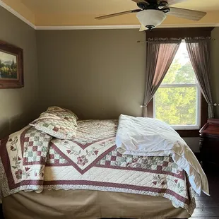 a bed with a quilt on it