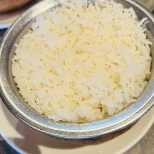 a bowl of rice and a bowl of curry