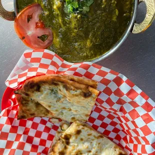 a bowl of soup and a sandwich