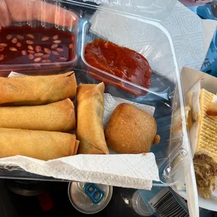Fire! All veggie rolls and cheesy puffs with sweet and spicy sauce. Traditional Indian cake. So good!