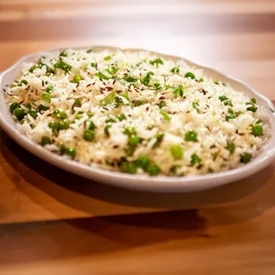 a plate of rice and peas