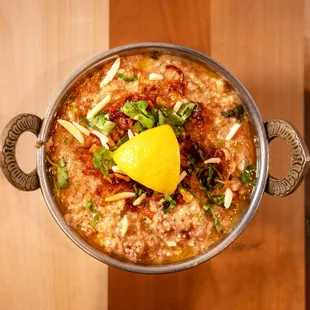 a bowl of food on a wooden table