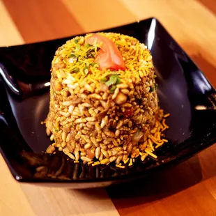 a plate of food on a wooden table