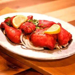 a plate of food on a wooden table