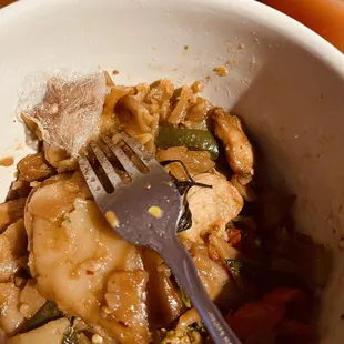 a fork in a bowl of food