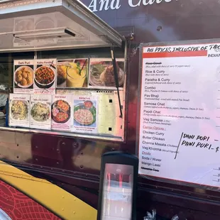 a food truck with a menu on the side