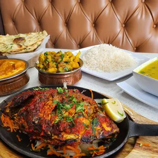 We feasted!  Tandoori fish, lentil soup, cauliflower, potatoes, chicken tikka and garlic naan.  Amazingness!