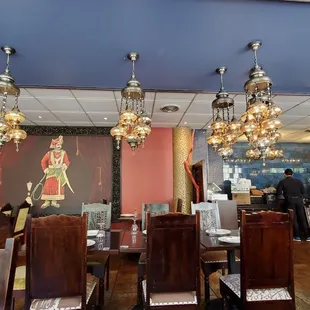 a dining room with chandeliers