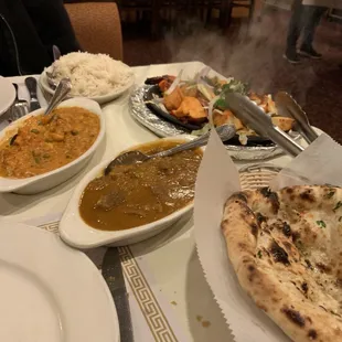 Most of the &quot;Dinner for 2&quot; including Chicken Tikka, Tandoori Shrimp, Lamb Mango, Vegetable Makhani, and Basmati Rice.