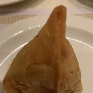 Samosa. I took a corner before taking the picture.