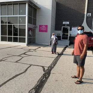 My son Tauqir Sagri and wife Sabiha Sagri at the entrance of the store.