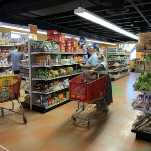 My wife Sabiha Sagri and sons Tanvir and Tauqir are busy selecting their items of interest.