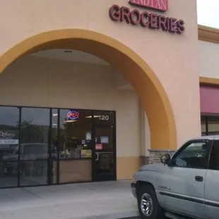 a car parked in front of the store
