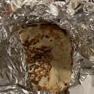 a burrito wrapped in tin foil