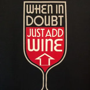 a wine glass with the words when in doubt, just add wine