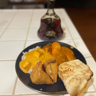 Dinner is served!!!! Chicken curry,Shahi paneer, Amritsari fish tikka, samosas, rice, and you can't for get the butter naan...