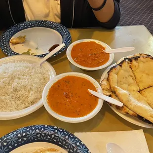 a plate of naan, rice, and naan bread