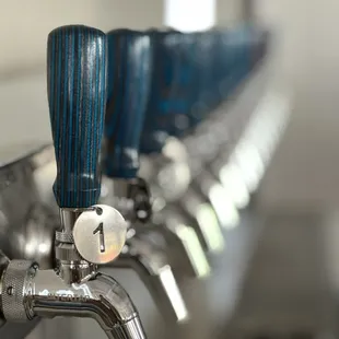 a row of beer taps