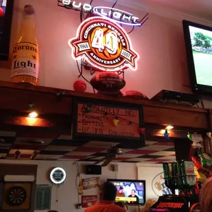 a neon sign above the bar